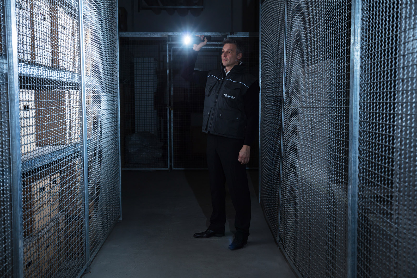 Security Guard Standing In The Warehouse